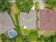Aerial view displays the property's landscaped yard, screened lanai, and proximity to neighboring homes at 903 Kersfield Cir, Lake Mary, FL 32746