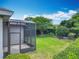 Features a screened-in lanai offering views of the lush, green backyard at 903 Kersfield Cir, Lake Mary, FL 32746