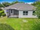 Enjoy the expansive backyard with lush greenery and a screened lanai for outdoor living at 903 Kersfield Cir, Lake Mary, FL 32746
