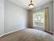 Bedroom with carpeted floors, neutral paint, and a large window with curtains for ample natural light at 903 Kersfield Cir, Lake Mary, FL 32746