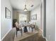 Elegant dining room featuring a modern table, stylish chairs, and natural light, ideal for Gathering gatherings at 903 Kersfield Cir, Lake Mary, FL 32746