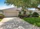 Well-manicured front yard with a lush lawn and mature trees framing the charming home at 903 Kersfield Cir, Lake Mary, FL 32746
