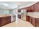 Well-equipped kitchen with stainless steel appliances, granite countertops, and seamless access to the living area at 903 Kersfield Cir, Lake Mary, FL 32746