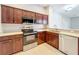 Updated kitchen featuring stainless steel appliances, granite countertops, and tiled flooring at 903 Kersfield Cir, Lake Mary, FL 32746