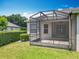 Enjoy outdoor living with this home's spacious screened lanai overlooking the lush green backyard at 903 Kersfield Cir, Lake Mary, FL 32746