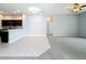 Open-concept living area with tile and carpet flooring, leading to the kitchen and entry at 903 Kersfield Cir, Lake Mary, FL 32746