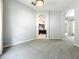 Spacious living room with neutral paint, carpeted floors, and an arched doorway at 903 Kersfield Cir, Lake Mary, FL 32746