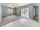 Living room showing carpeted floors, sliding glass doors and a ceiling fan at 903 Kersfield Cir, Lake Mary, FL 32746