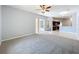 Open living space featuring access to the kitchen and screened-in patio at 903 Kersfield Cir, Lake Mary, FL 32746