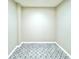 Walk-in closet featuring black and white patterned tile flooring at 9490 Sw 85Th Ave # E, Ocala, FL 34481