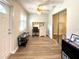 Office space with laminate flooring, natural light, ceiling fan and built-in shelves at 9490 Sw 85Th Ave # E, Ocala, FL 34481