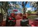 Backyard deck with outdoor seating and blue house at 1000 Pennsylvania Ave, Lakeland, FL 33803