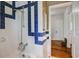 Bathroom showcasing patterned blue and white tiling at 1000 Pennsylvania Ave, Lakeland, FL 33803