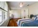 Bright, comfortable bedroom with hardwood floors, white trim, and ample natural light from large windows at 1000 Pennsylvania Ave, Lakeland, FL 33803