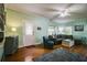 Comfortable living room with a stylish rug, large windows, and a cozy seating area for relaxation at 1000 Pennsylvania Ave, Lakeland, FL 33803