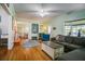 Inviting living room featuring hardwood floors, an area rug, and comfortable seating, blending style and comfort at 1000 Pennsylvania Ave, Lakeland, FL 33803
