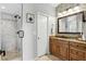 Bathroom with a glass enclosed shower, mosaic tile accents, and wood vanity at 1129 Golfside Dr, Winter Park, FL 32792