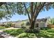 Single-story home with mature tree and landscaping at 1129 Golfside Dr, Winter Park, FL 32792