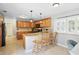 Updated kitchen featuring custom cabinets, granite countertops, pendant lighting, and stainless appliances at 1129 Golfside Dr, Winter Park, FL 32792