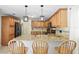 Open kitchen with granite countertops, stainless steel appliances, and wooden barstool seating at 1129 Golfside Dr, Winter Park, FL 32792