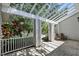 Covered patio with brick flooring and landscaping at 1129 Golfside Dr, Winter Park, FL 32792