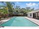 A beautiful pool surrounded by brick pavers and lush landscaping, providing a serene outdoor oasis at 1129 Golfside Dr, Winter Park, FL 32792
