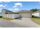Well-maintained single-Gathering home with a two-car garage, fenced backyard, and driveway at 12936 Freeman St, Windermere, FL 34786