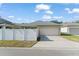 Well-maintained single-Gathering home with a two-car garage, fenced backyard, and driveway at 12936 Freeman St, Windermere, FL 34786