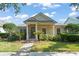 Charming single-story home with a covered porch, columns, and well-manicured landscaping at 12936 Freeman St, Windermere, FL 34786