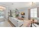 Bright living room with light gray walls, hardwood floors, stylish lighting and neutral modern furniture at 12936 Freeman St, Windermere, FL 34786