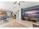 Large home-theater and living-room combination with kitchen and dining area beyond at 12936 Freeman St, Windermere, FL 34786
