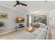 Contemporary living room with hardwood floors, modern furniture, flat screen television, and stylish decor at 12936 Freeman St, Windermere, FL 34786