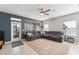 Spacious living room features an oversized sectional sofa, and direct access to the backyard at 12936 Freeman St, Windermere, FL 34786