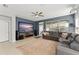 Home theater room features a large TV, comfortable seating, and surround sound speakers at 12936 Freeman St, Windermere, FL 34786