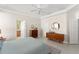 Open main bedroom with tiled floors, crown molding, and ensuite bathroom at 12936 Freeman St, Windermere, FL 34786