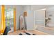 Home office with hardwood floors, sunny window, and an open doorway to the living room at 12936 Freeman St, Windermere, FL 34786