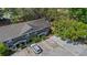 Aerial view of this townhouse featuring mature landscaping, ample parking, and a cozy exterior at 130 Kristi Ann Ct, Winter Springs, FL 32708