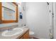 Well-lit bathroom with a single sink vanity, toilet, and shower at 130 Kristi Ann Ct, Winter Springs, FL 32708