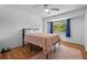 Bright bedroom with a window, wood floors, and ceiling fan, providing natural light and ventilation at 130 Kristi Ann Ct, Winter Springs, FL 32708