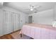 Bedroom featuring a ceiling fan and a closet, offering practical storage and a comfortable atmosphere at 130 Kristi Ann Ct, Winter Springs, FL 32708