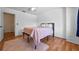 Cozy bedroom with wood floors, ceiling fan, and minimalist decor creates a serene and inviting space at 130 Kristi Ann Ct, Winter Springs, FL 32708