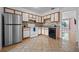 Bright kitchen with tile flooring, white cabinets, a stainless steel refrigerator, and modern appliances at 130 Kristi Ann Ct, Winter Springs, FL 32708