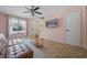 Cozy living room with tile flooring, neutral walls, ceiling fan, and natural light at 130 Kristi Ann Ct, Winter Springs, FL 32708