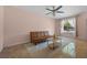 Bright living room featuring tile floors, a comfortable couch, and sunlit windows at 130 Kristi Ann Ct, Winter Springs, FL 32708