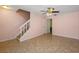 Living room with staircase, tile flooring, and open access to other rooms at 130 Kristi Ann Ct, Winter Springs, FL 32708
