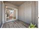 Enclosed patio with sliding glass doors offers serene indoor-outdoor living on attractive laminate flooring at 130 Kristi Ann Ct, Winter Springs, FL 32708