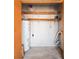A well-lit storage space features a GE water heater and shelving to keep organized household essentials at 130 Kristi Ann Ct, Winter Springs, FL 32708