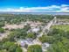 Aerial view showcasing the neighborhood, green spaces and proximity to the water at 1314 S Mellonville Ave, Sanford, FL 32771