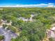 Aerial view of a neighborhood with mature trees offering shade and privacy at 1314 S Mellonville Ave, Sanford, FL 32771