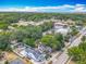 A high angle view of a home with a spacious yard, pool, and tree coverage at 1314 S Mellonville Ave, Sanford, FL 32771
